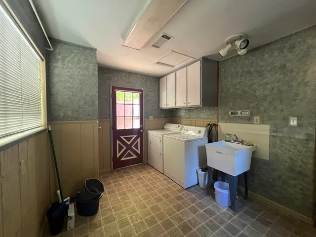 a room with a chair and gym equipment