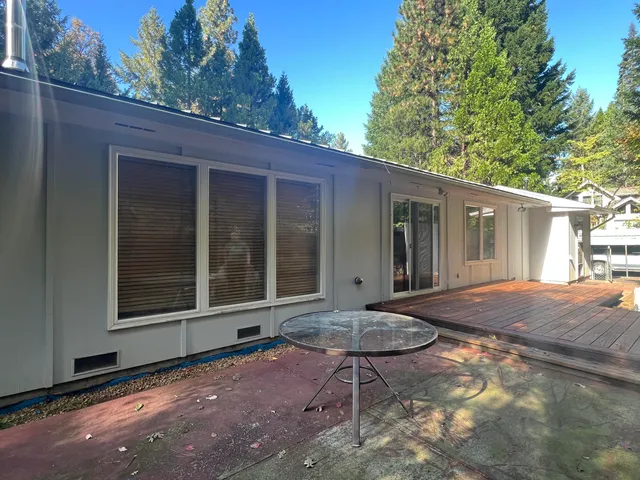 a view of a house with a yard and garage
