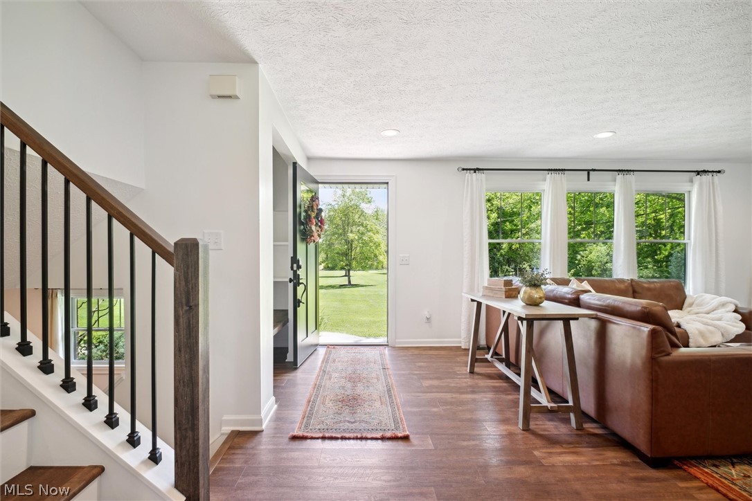 2035 Porter Road Atwater, OH 44201 - Photo 7 of 50 Entrance foyer with a textured ceiling and dark vinyl flooring