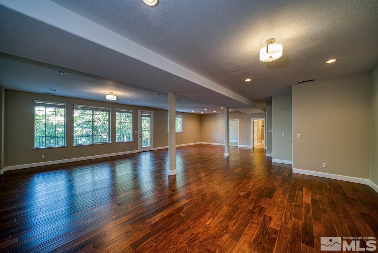 3375 Corey Drive Reno, NV 89509 - Photo 23 of 39 an empty room with wooden floor and windows