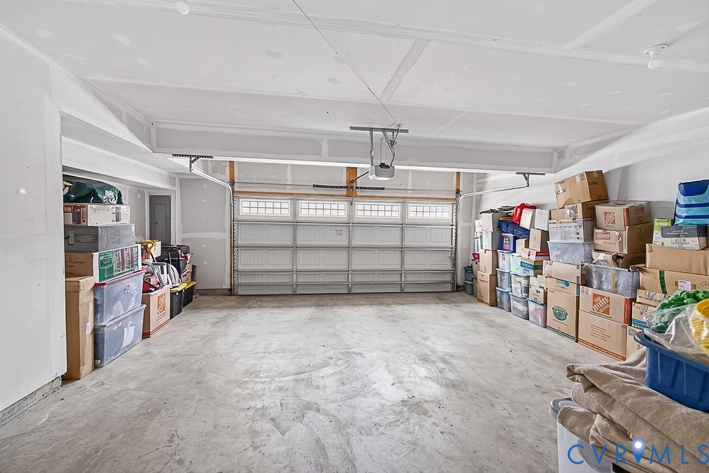 17976 Spotted Oak Road Dumfries, VA 22026 - Photo 45 of 52 Spacious garage with a light-colored concrete floo