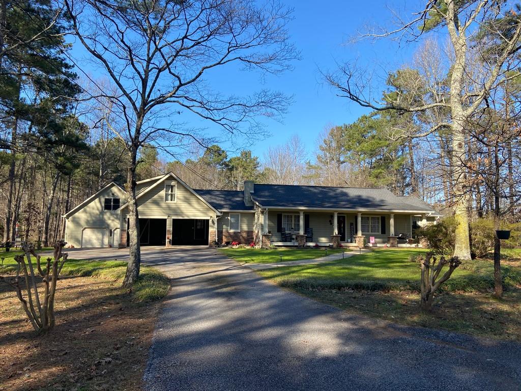 157 Old Griffin Road Dallas, GA 30157 - Photo 1 of 1 a front view of a building with a garden