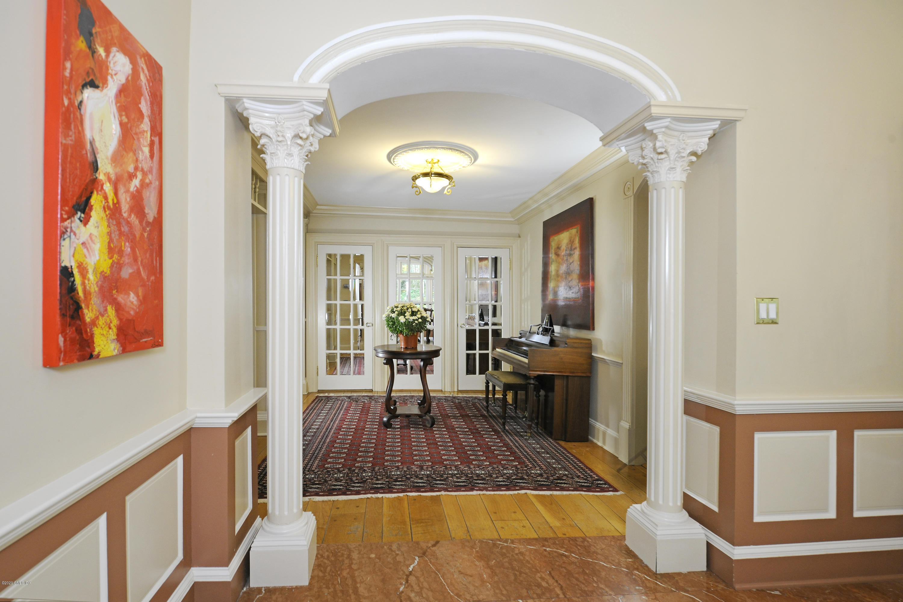 317 Riversville Road Greenwich, CT 06831 - Photo 9 of 28 a living room with furniture and a fireplace