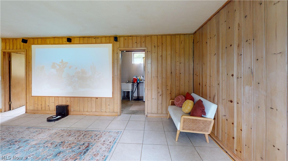 9260 Avery Road Broadview Heights, OH 44147 - Photo 31 of 43 Wood-paneled walls with a built-in projection screen, recessed lighting, and light-toned tile flooring