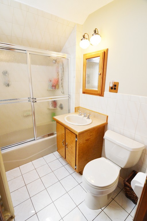 73 Castle Street Springfield, MA 01118 - Photo 12 of 30 a bathroom with a sink a toilet and shower