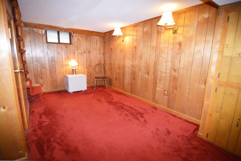 73 Castle Street Springfield, MA 01118 - Photo 22 of 30 a bed room with a bed and a curtain
