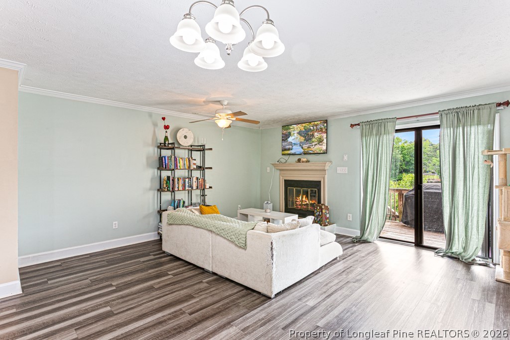461 Lands End Road Fayetteville, NC 28314 - Photo 12 of 31 a living room with fireplace furniture and a wooden floor