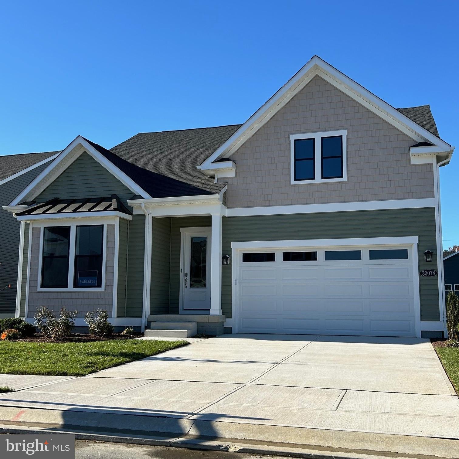 30078 Chase Oaks Drive Lewes, DE 19958 - Photo 1 of 17 a front view of a house with a yard