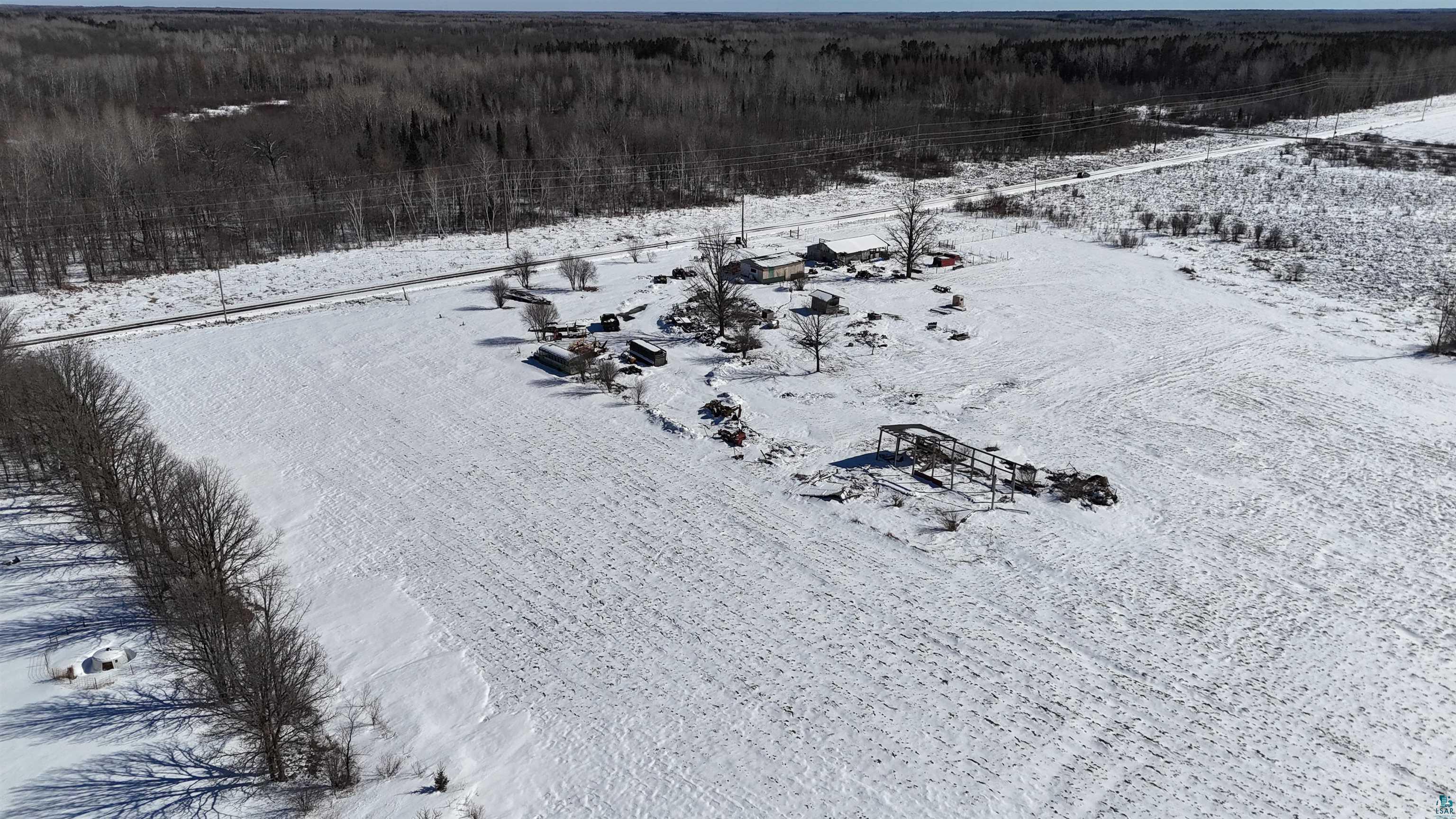2865 Lund Road Kettle River, MN 55757 - Photo 19 of 21 Snowy aerial view with a view of trees