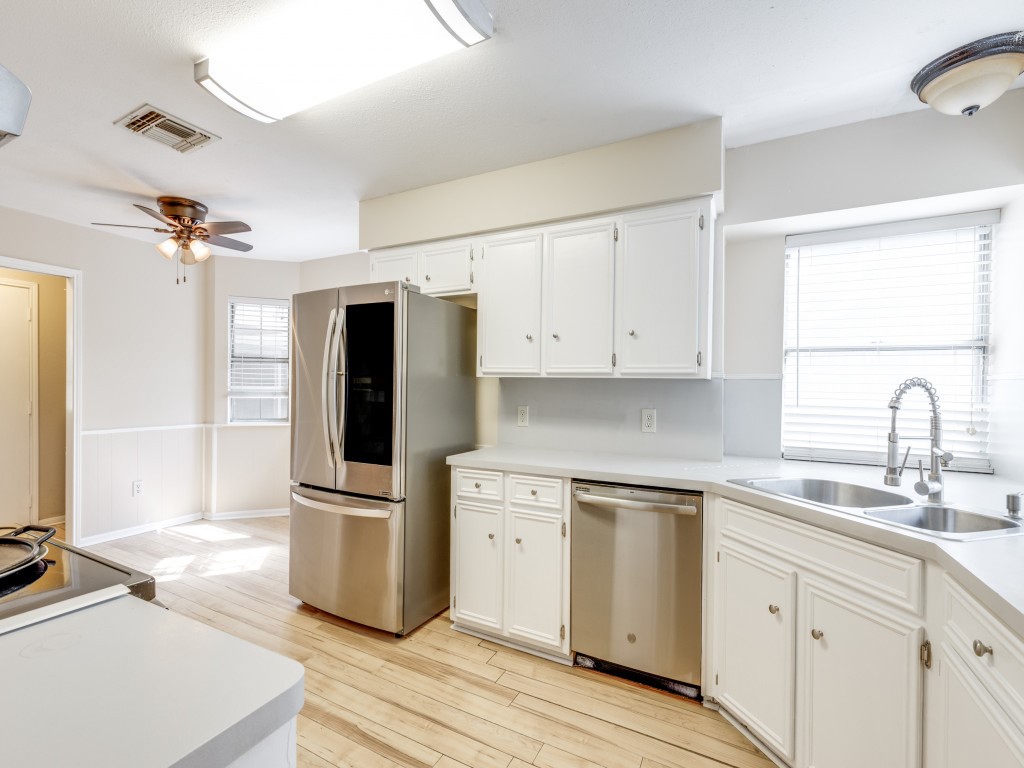 2403 Pecan Wood Lane Rosenberg, TX 77471 - Photo 11 of 25 a kitchen with a refrigerator and a sink