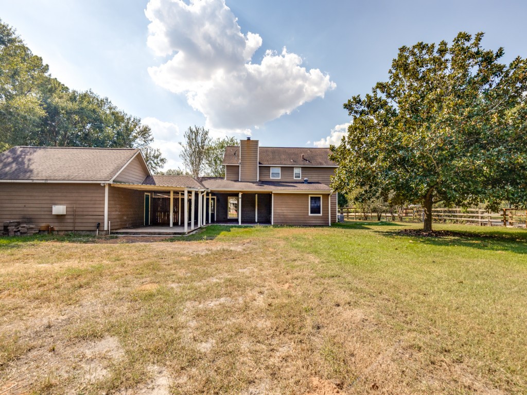 2403 Pecan Wood Lane Rosenberg, TX 77471 - Photo 21 of 25 a view of a house with a yard and sitting area
