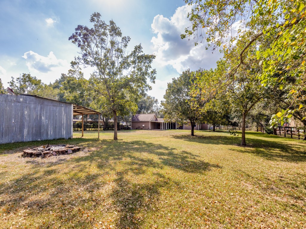 2403 Pecan Wood Lane Rosenberg, TX 77471 - Photo 23 of 25 a view of a yard with wooden fence