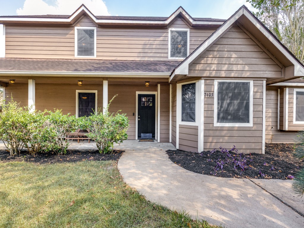 2403 Pecan Wood Lane Rosenberg, TX 77471 - Photo 4 of 25 a front view of a house with a yard