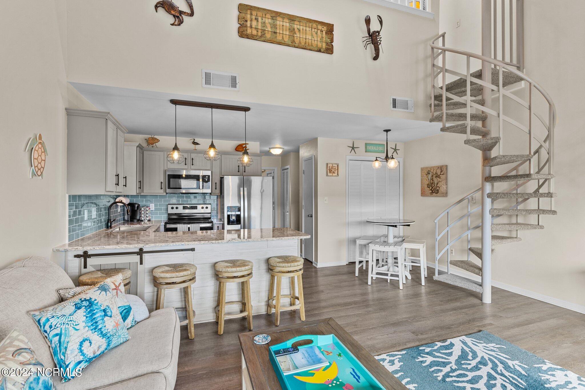 9201 Coast Guard Road, Unit G204 Emerald Isle, NC 28594 - Photo 14 of 40 living room/kitchen