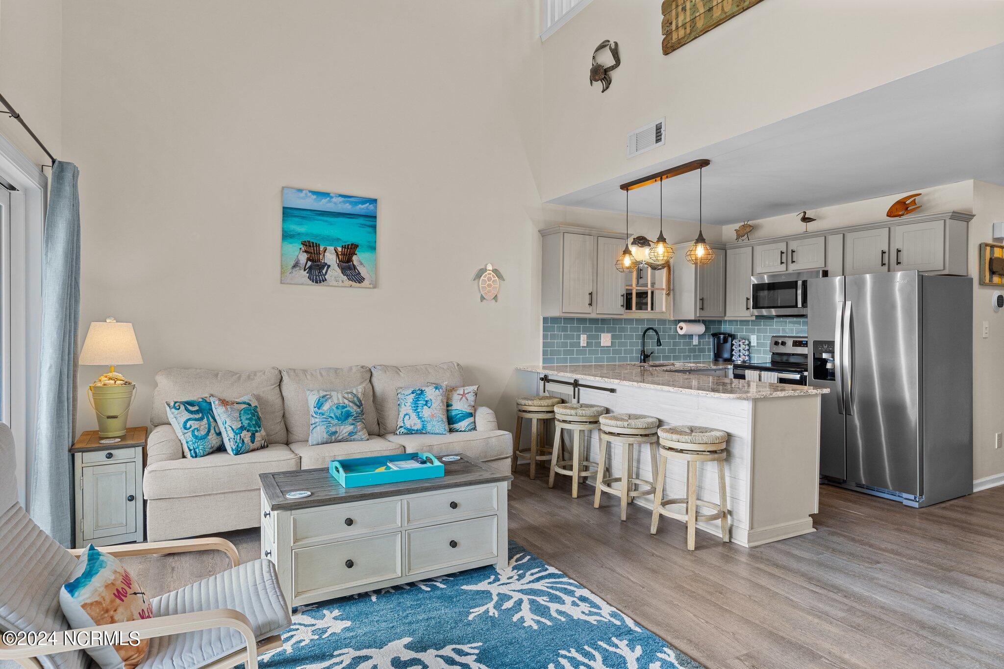 9201 Coast Guard Road, Unit G204 Emerald Isle, NC 28594 - Photo 16 of 40 living room/kitchen