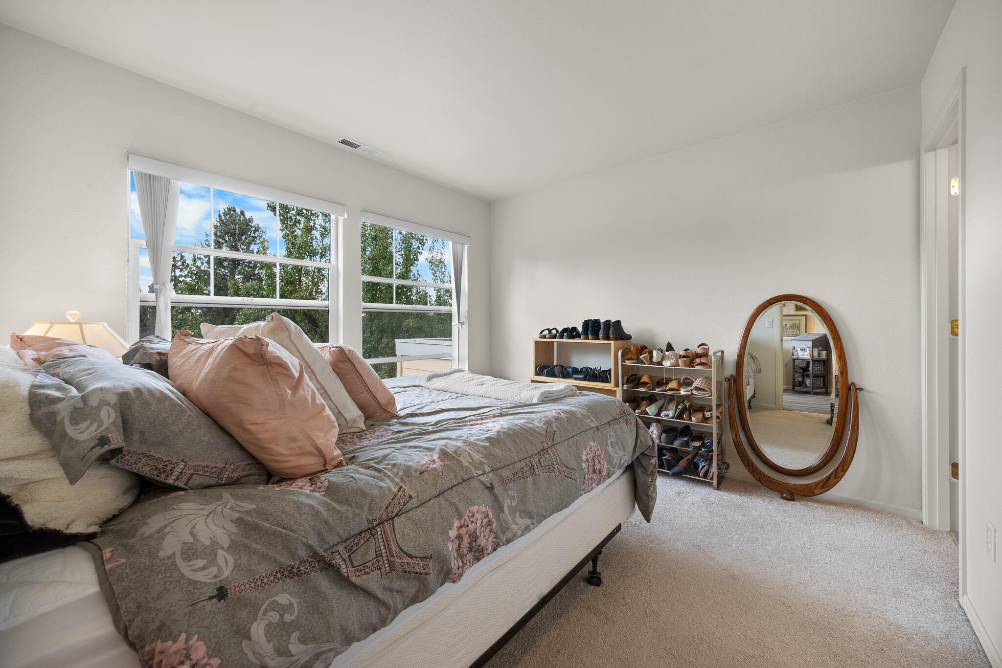 624 Southwest Hill Street Bend, OR 97702 - Photo 31 of 45 a bed room with large bed and a large window