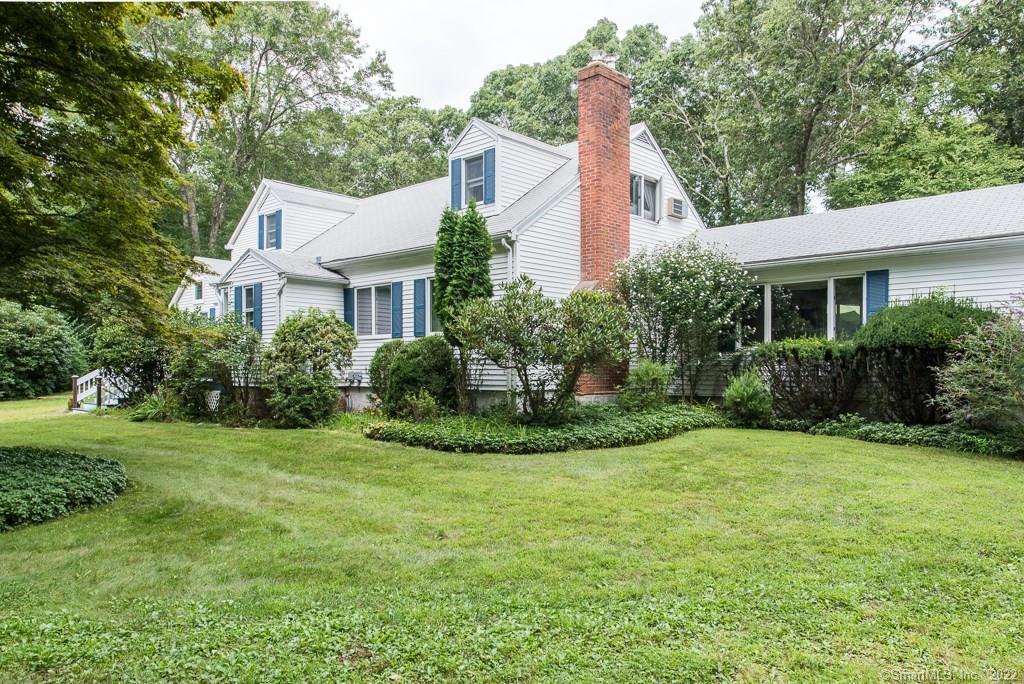 24 Burr Road Lyme, CT 06371 - Photo 1 of 1 a view of a house with a yard and potted plants