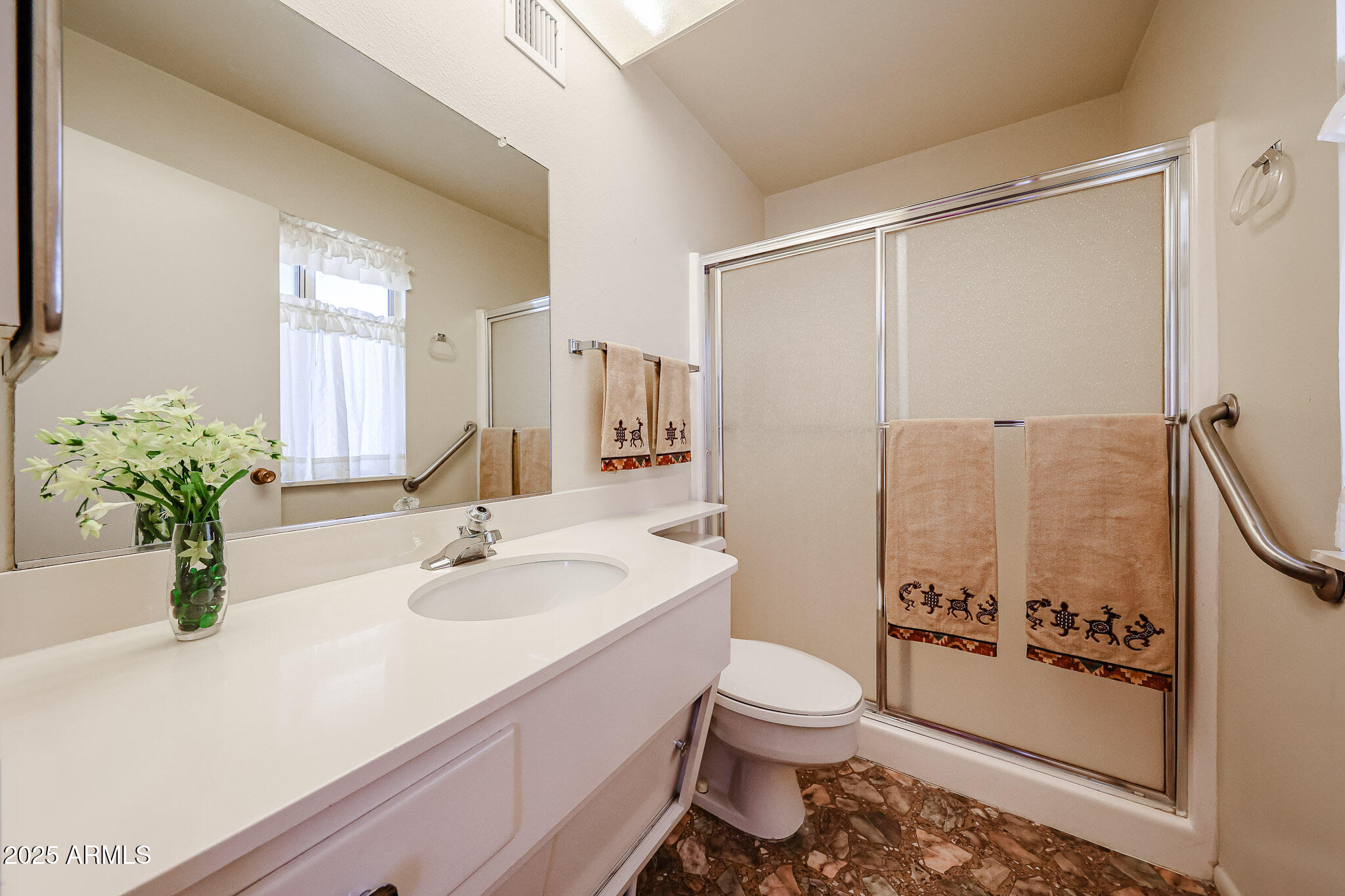 10326 West Pleasant Valley Road Sun City, AZ 85351 - Photo 16 of 25 a bathroom with a sink toilet and shower