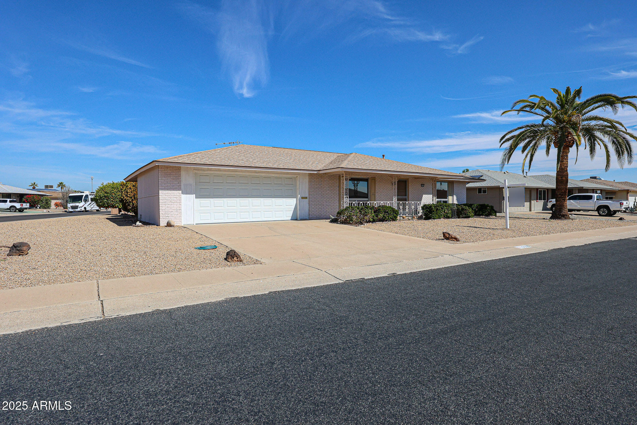 10326 West Pleasant Valley Road Sun City, AZ 85351 - Photo 20 of 25 a view of multiple house with outdoor space and lakeside