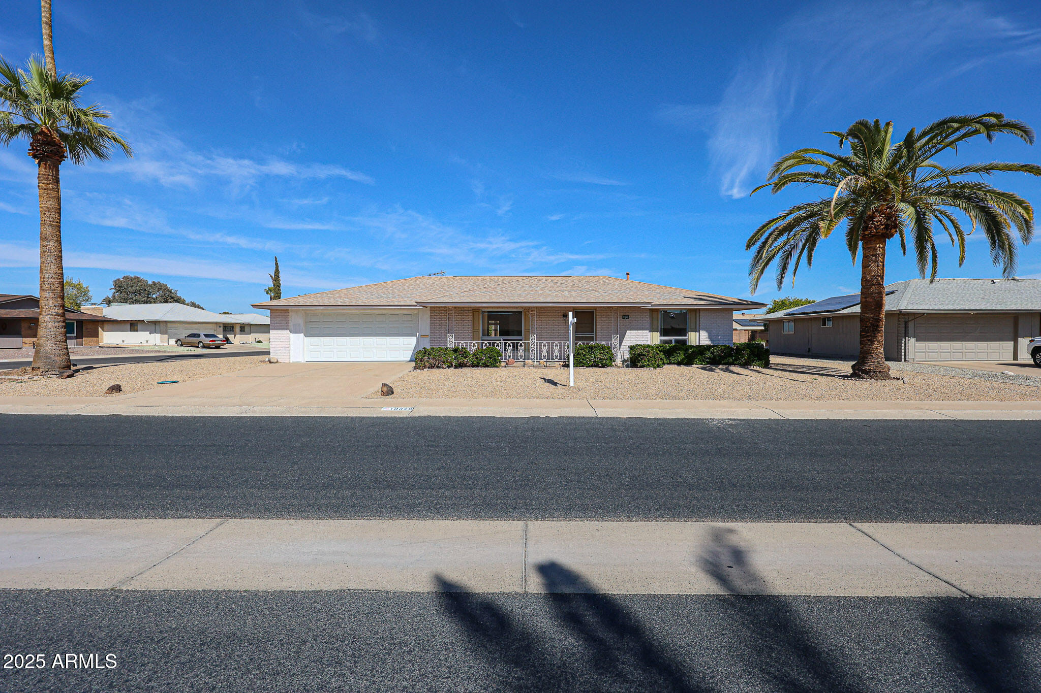 10326 West Pleasant Valley Road Sun City, AZ 85351 - Photo 25 of 25 a palm tree sitting in front of a building
