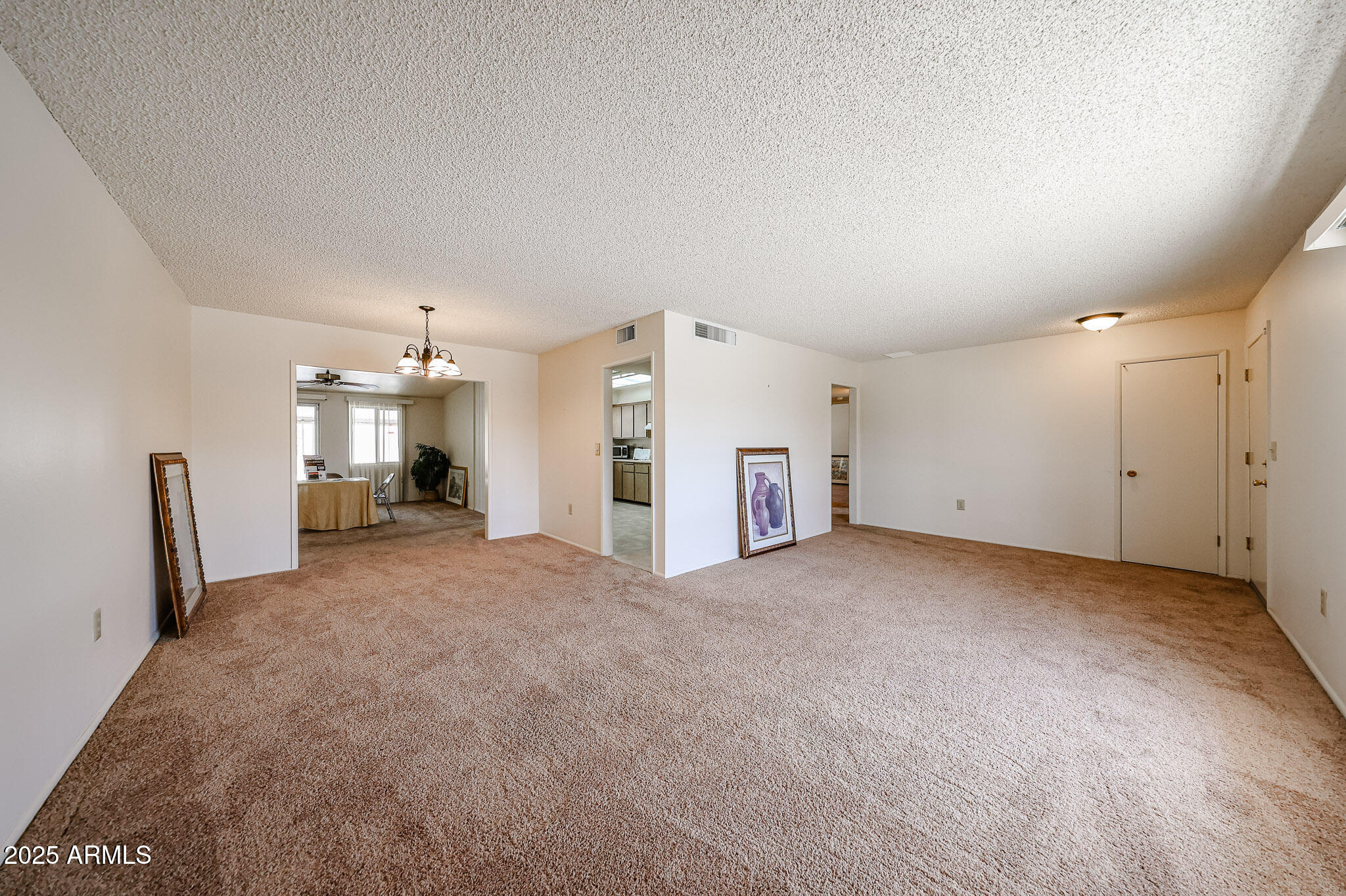 10326 West Pleasant Valley Road Sun City, AZ 85351 - Photo 8 of 25 a view of a big room with closet and windows