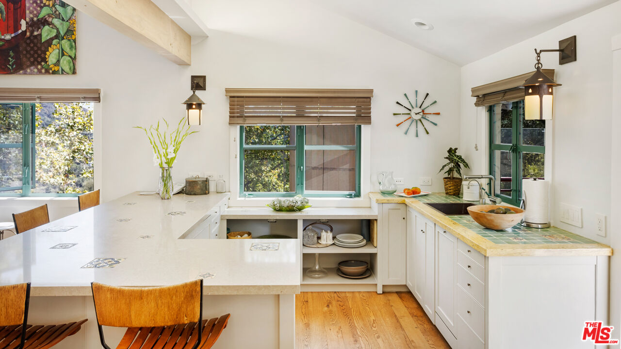 635-637 Greenleaf Canyon Road Topanga, CA 90290 - Photo 11 of 52 a kitchen with a stove a sink and a refrigerator