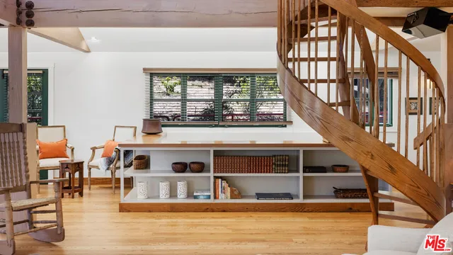 a view of living room with furniture and staircase