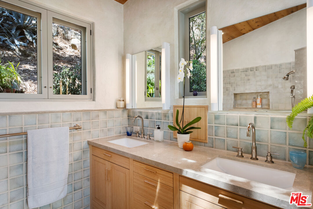 635-637 Greenleaf Canyon Road Topanga, CA 90290 - Photo 24 of 52 a bathroom with a sink and a window
