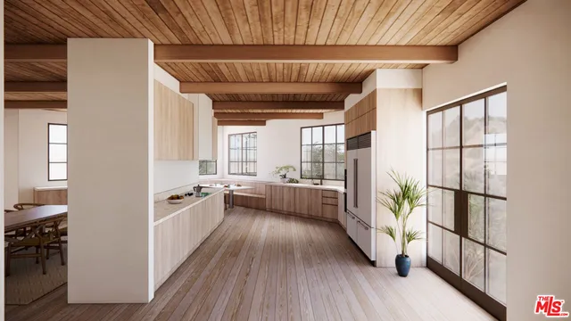 a view of a kitchen with furniture and a window
