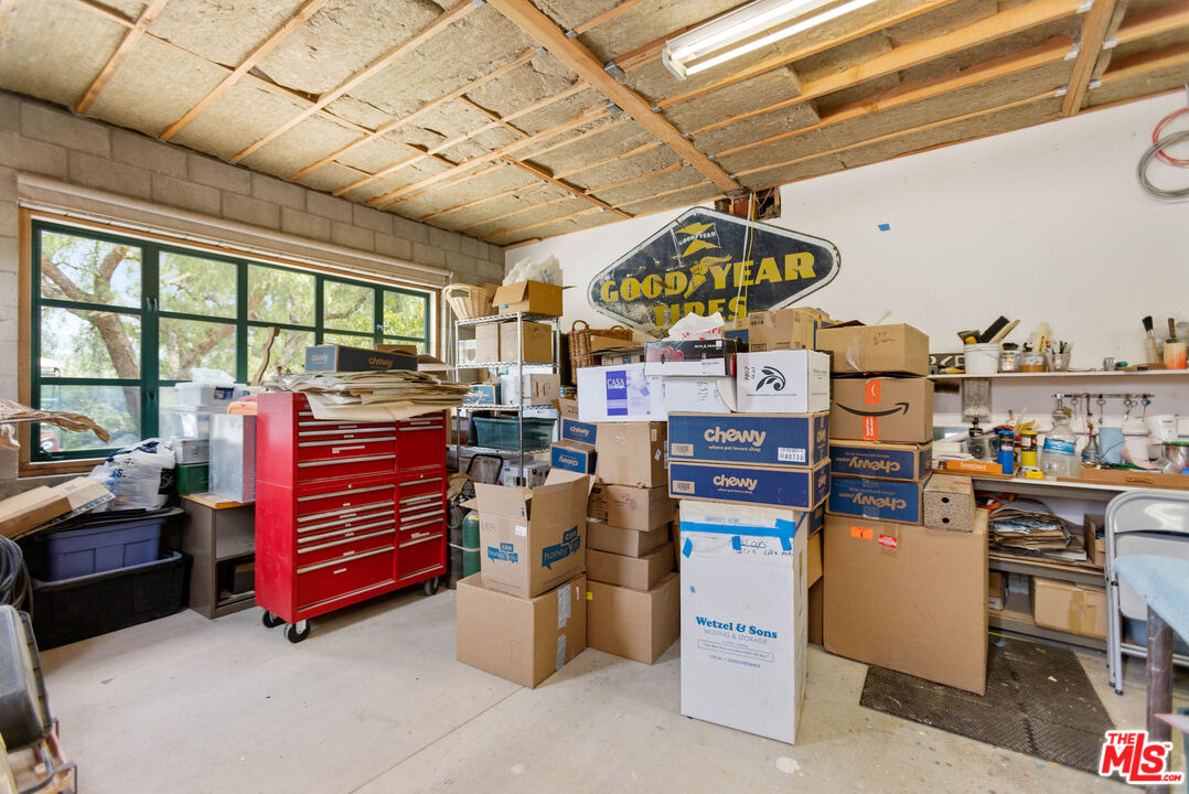 635-637 Greenleaf Canyon Road Topanga, CA 90290 - Photo 50 of 52 a room with lots of wooden furniture and a chandelier