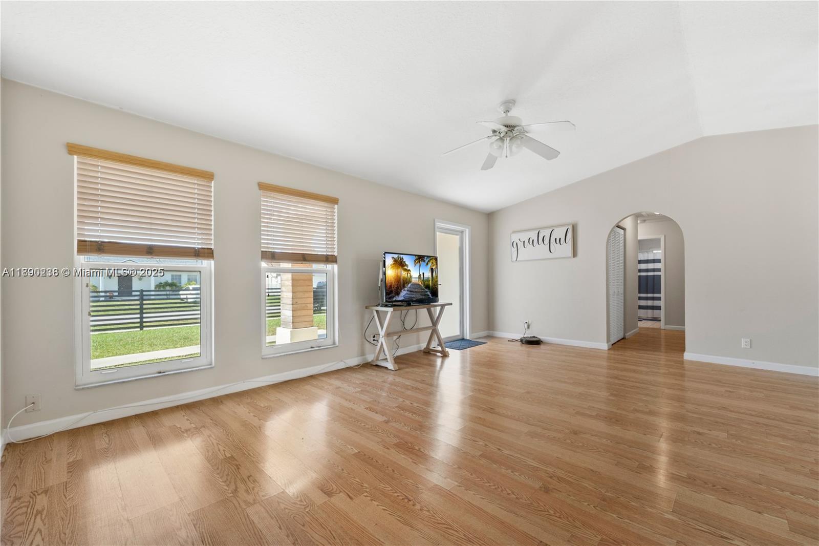 13752 Southwest 285th Street Homestead, FL 33033 - Photo 13 of 25 wooden floor in an empty room with a window