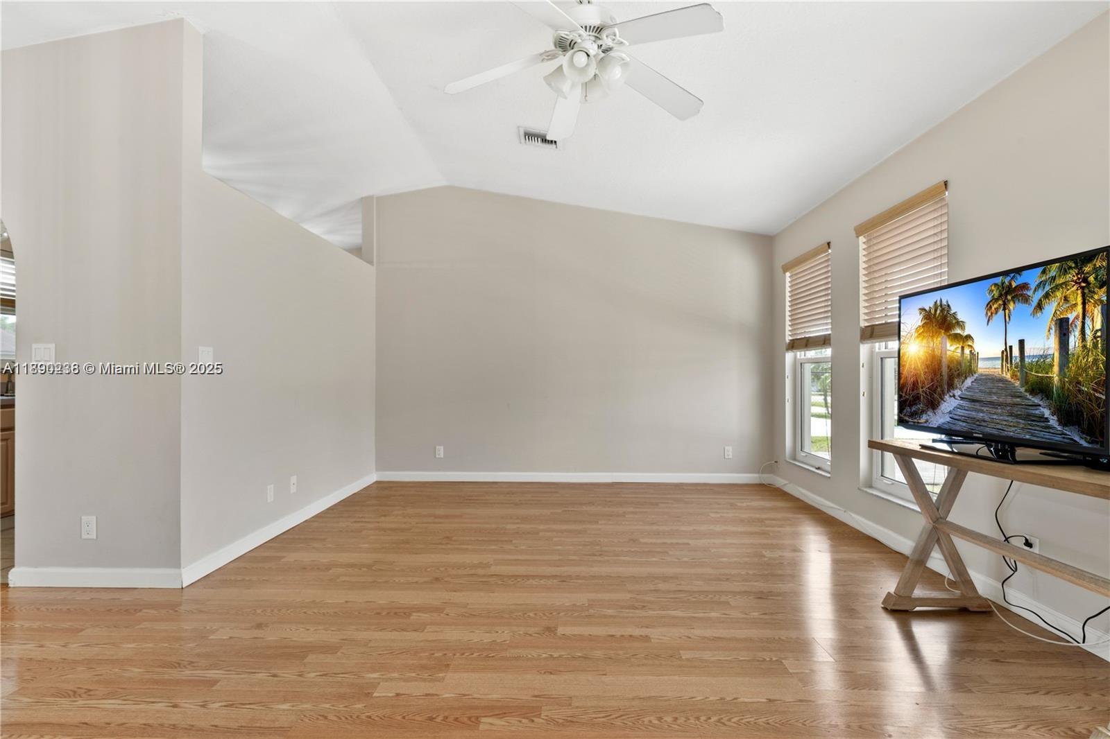 13752 Southwest 285th Street Homestead, FL 33033 - Photo 16 of 25 a view of an empty room with wooden floor and a window