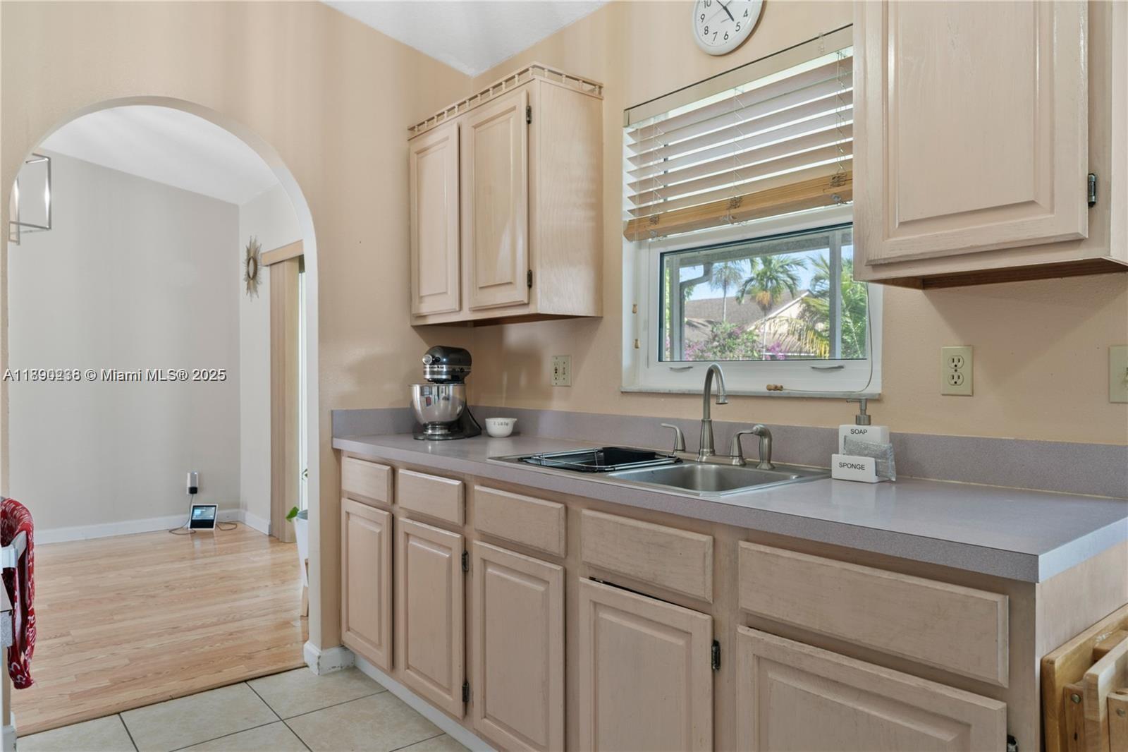 13752 Southwest 285th Street Homestead, FL 33033 - Photo 18 of 25 a kitchen with stainless steel appliances granite countertop a sink and cabinets