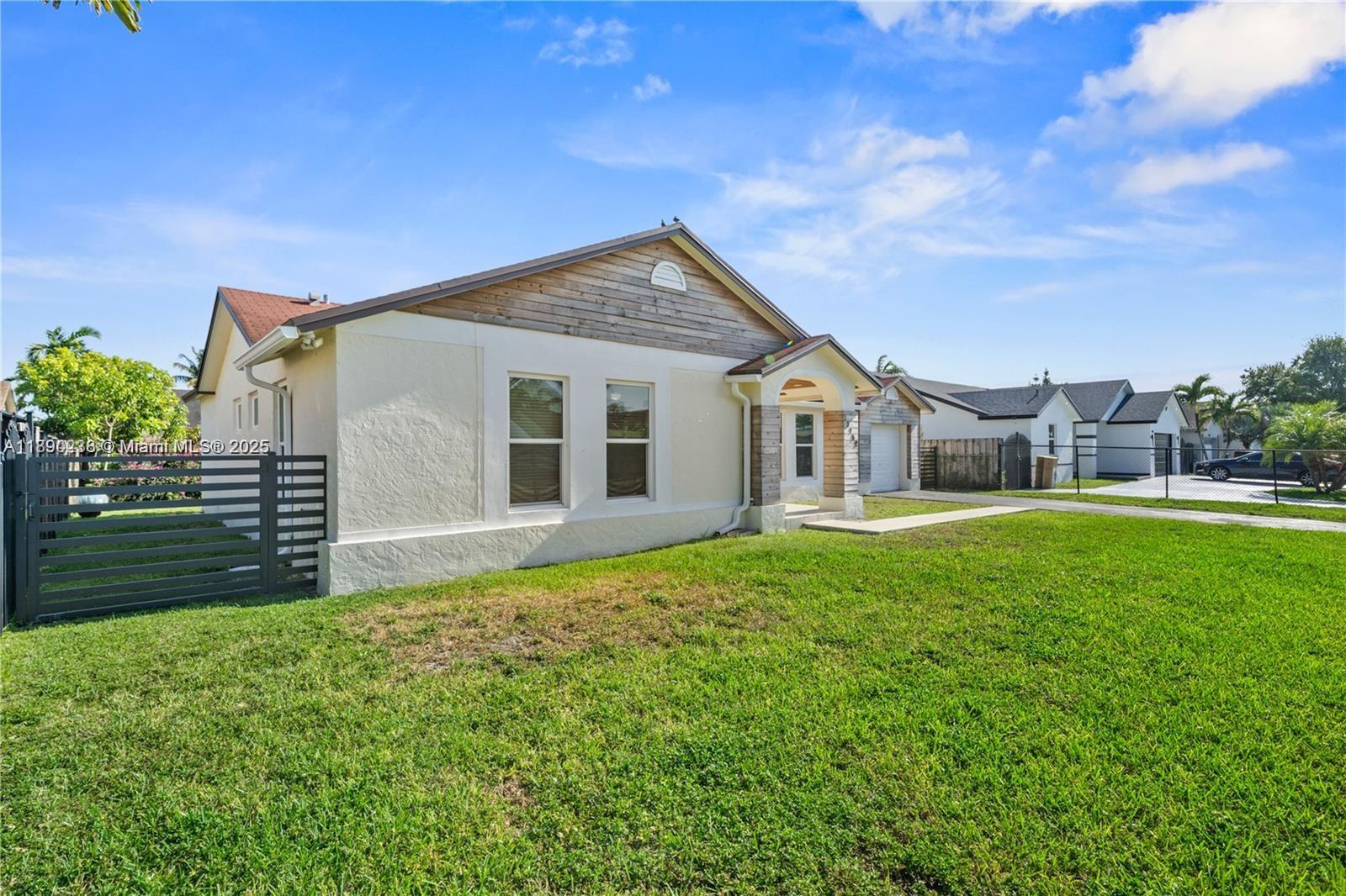 13752 Southwest 285th Street Homestead, FL 33033 - Photo 2 of 25 a view of a house with a backyard