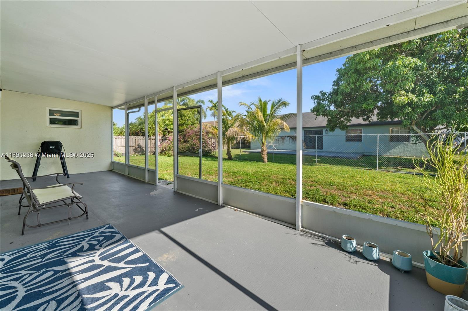 13752 Southwest 285th Street Homestead, FL 33033 - Photo 22 of 25 a view of a living room and floor to ceiling window