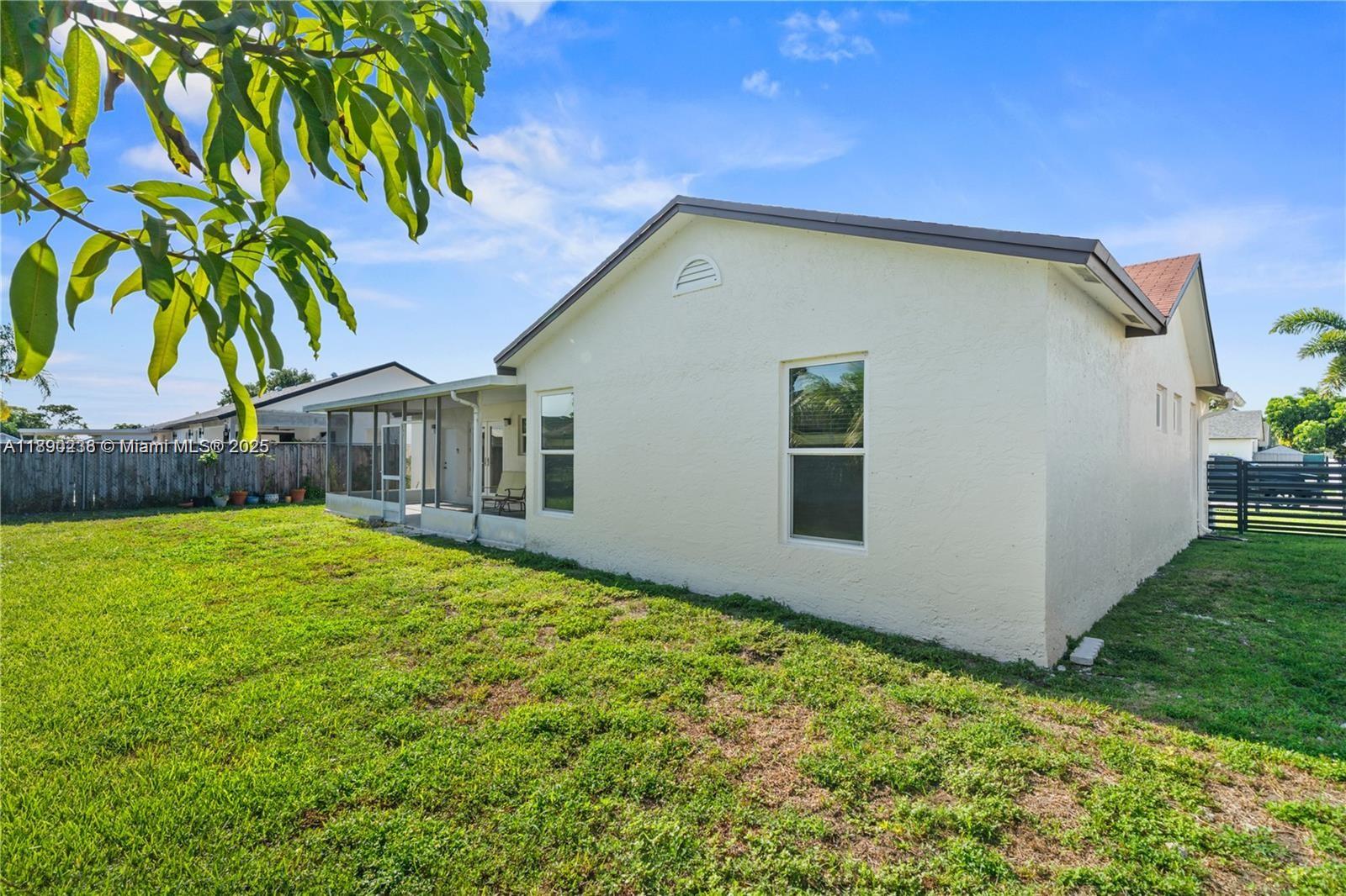 13752 Southwest 285th Street Homestead, FL 33033 - Photo 24 of 25 a backyard of a house with lots of green space