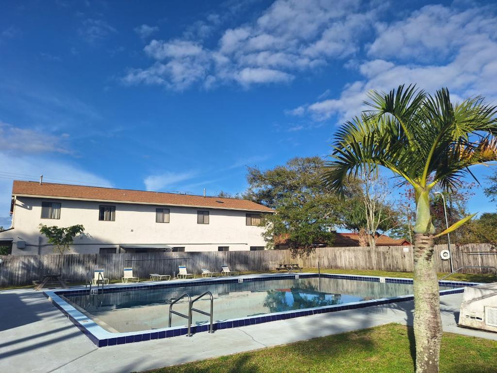4875 Sisson Road Titusville, FL 32780 - Photo 13 of 14 a view of swimming pool with outdoor seating