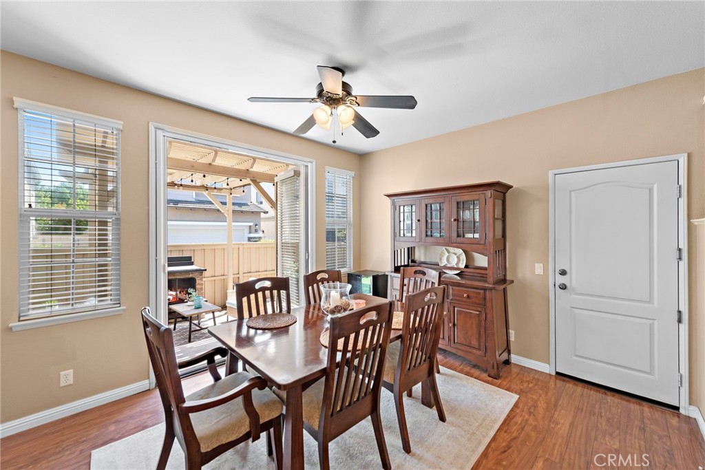81 Mercantile Way Ladera Ranch, CA 92694 - Photo 11 of 51 a view of a dining room with furniture window and wooden floor