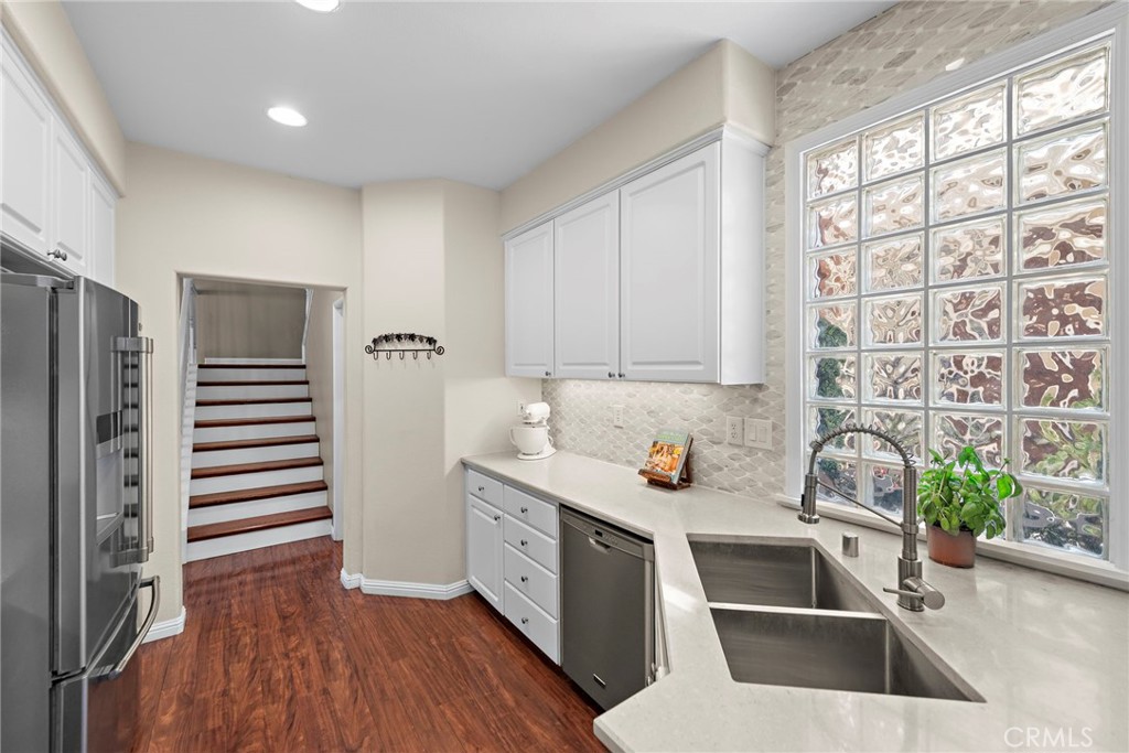 81 Mercantile Way Ladera Ranch, CA 92694 - Photo 16 of 51 a kitchen with a sink cabinets and appliances