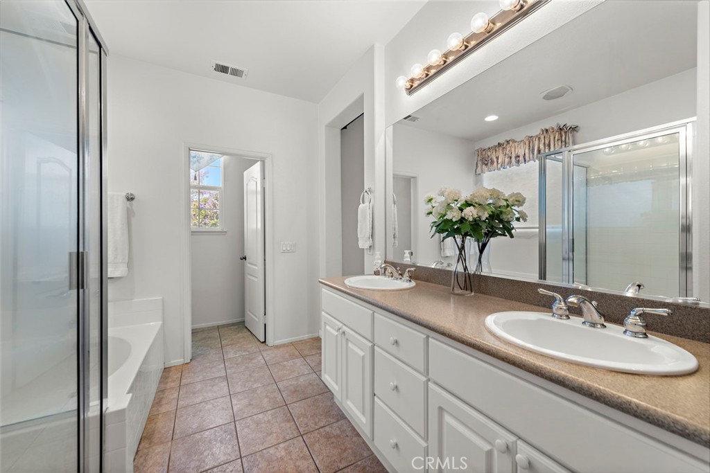 81 Mercantile Way Ladera Ranch, CA 92694 - Photo 20 of 51 a bathroom with a sink and a mirror