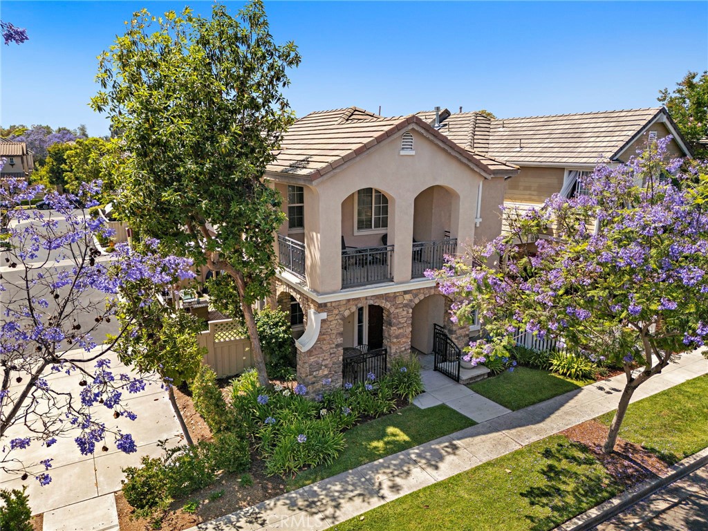81 Mercantile Way Ladera Ranch, CA 92694 - Photo 35 of 51 a front view of a house with a garden