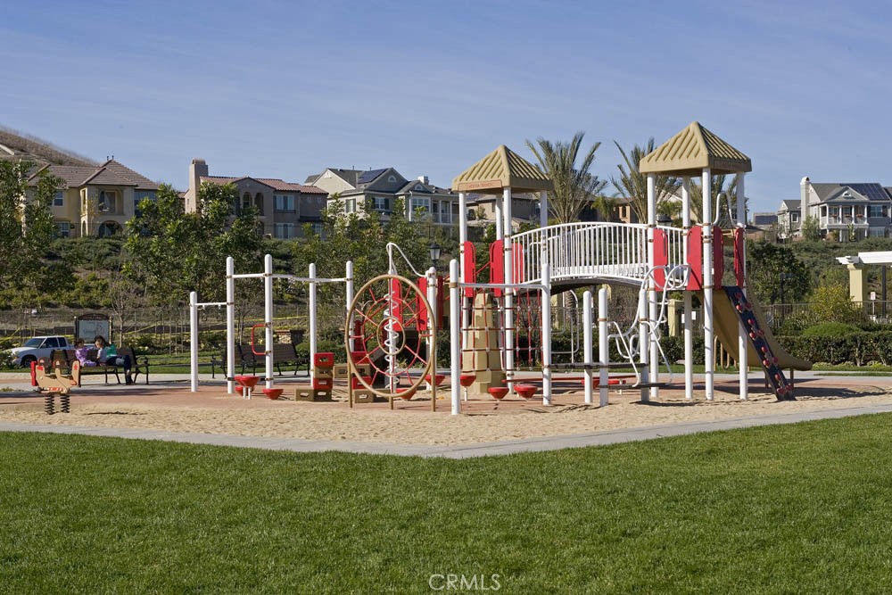 81 Mercantile Way Ladera Ranch, CA 92694 - Photo 50 of 51 a front view of multi story residential apartment building with outdoor seating and floor to ceiling window