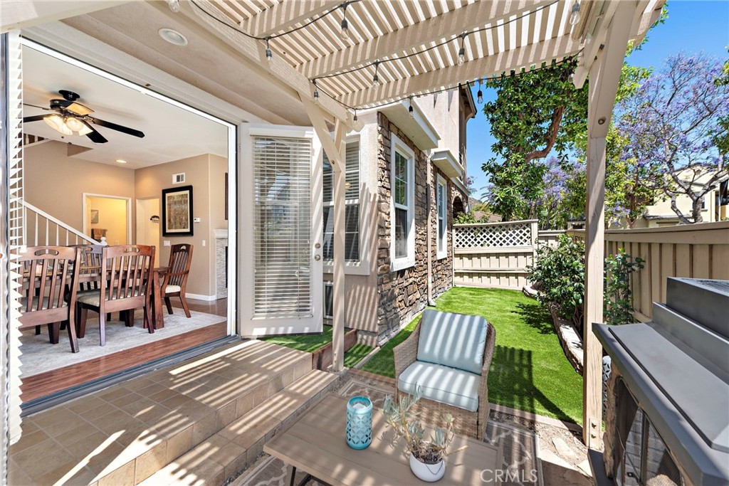 81 Mercantile Way Ladera Ranch, CA 92694 - Photo 5 of 51 a view of a patio with couches chairs potted plants and wooden floor