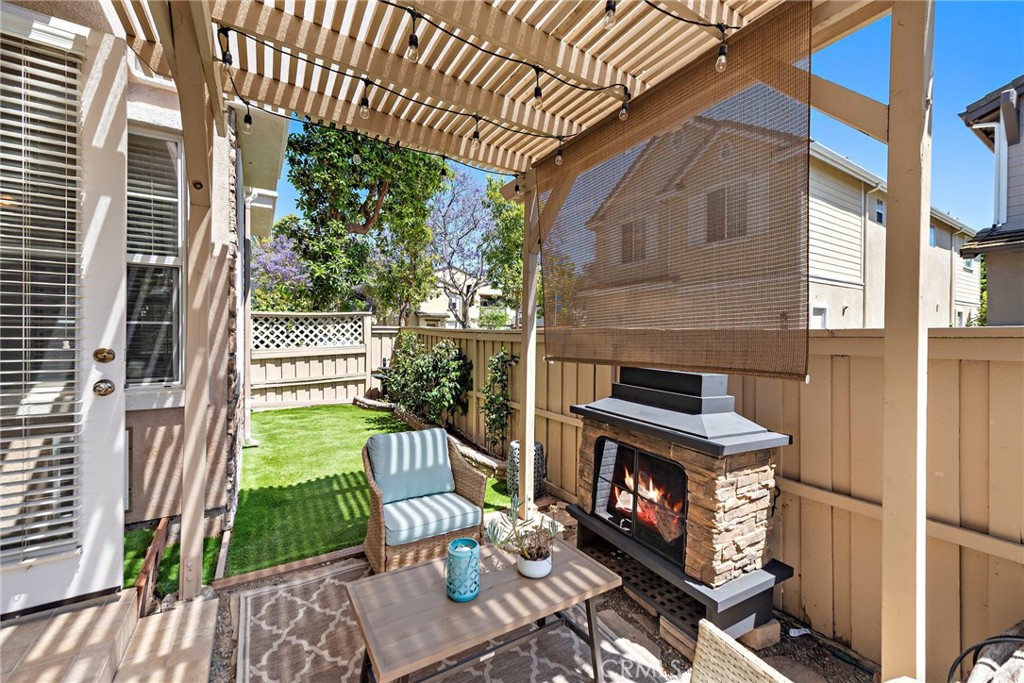 81 Mercantile Way Ladera Ranch, CA 92694 - Photo 6 of 51 a view of a porch with furniture and a fireplace