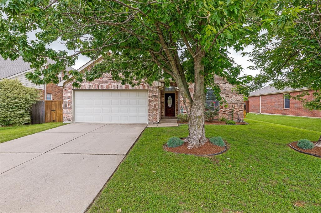 4305 Ridgewood Road Melissa, TX 75454 - Photo 1 of 26 Brick facade residence featuring an attached two-car garage, concrete driveway, and front lawn with mature trees