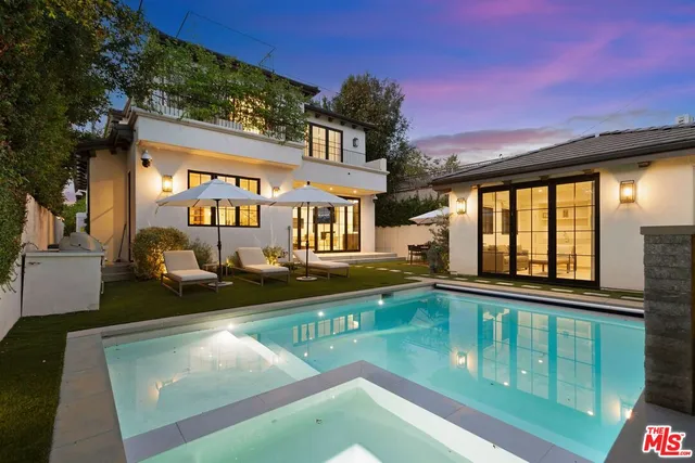 a view of a swimming pool with a patio