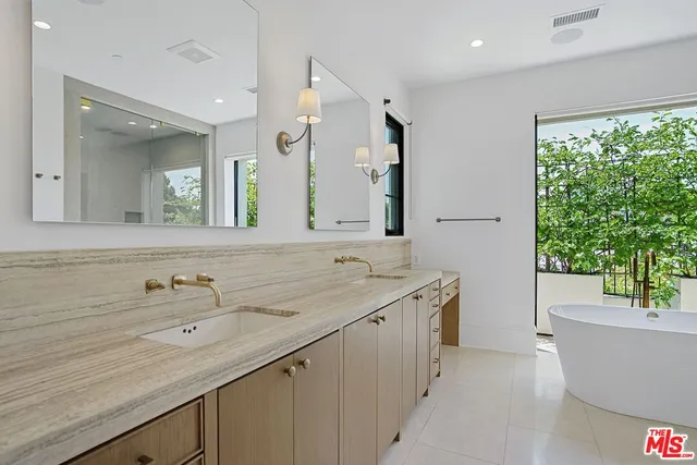 a bathroom with a bathtub and sink