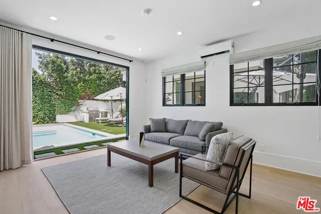 a living room with furniture and windows