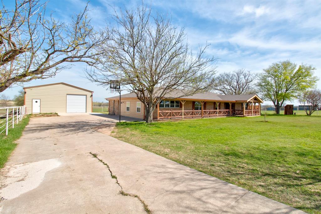 3884 Lois Road East Sanger, TX 76266 - Photo 6 of 40 front view of a house with a yard
