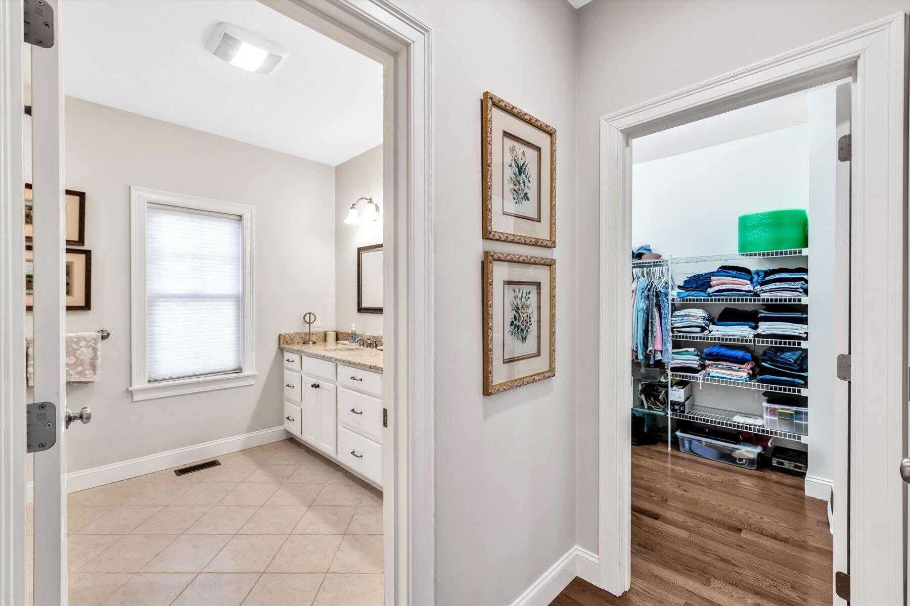 66 Eagle Drive Mashpee, MA 02649 - Photo 16 of 36 a spacious bathroom with a walk in closet and a window